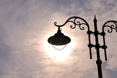 Low angle view of street light against sky