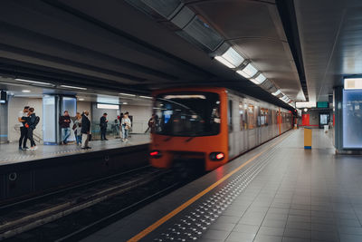 Train arriving at brussels metro station, belgium, motion blur.