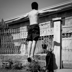 Woman standing by railing