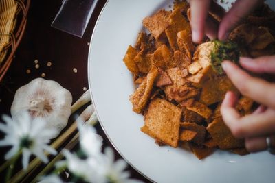 High angle view of person preparing food in plate