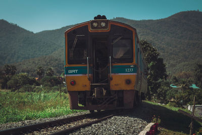 Train on railroad track against sky