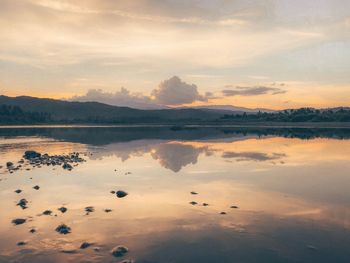 Scenic view of lake against sky during sunset