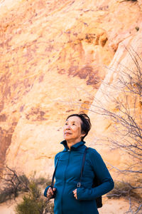 Portrait of senior asian woman in the desert landscape