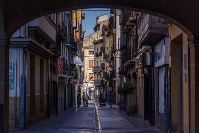 Narrow alley amidst buildings in city