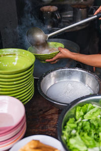 Cropped hand preparing food