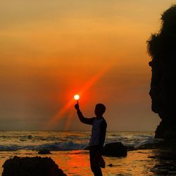 Scenic view of sea at sunset