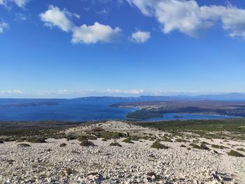 Scenic view of landscape against blue sky