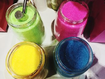 High angle view of candies in glass jar on table