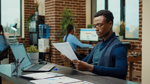 Man using digital tablet in office