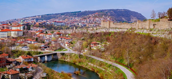 High angle view of river and cityscape against sky