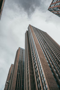 Low angle view of modern buildings against sky