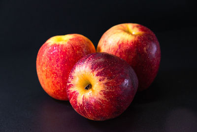 Close-up of apples against black background