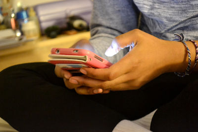 Close-up of hand holding cigarette