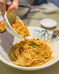Cropped hand of person having food