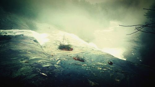 Scenic view of sea against cloudy sky