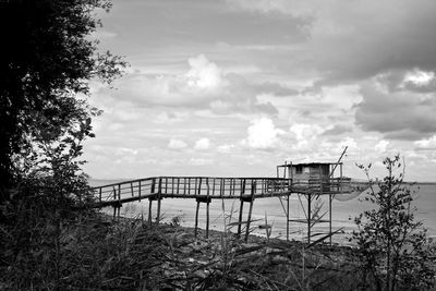 Abandoned bridge against sky