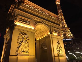 Low angle view of illuminated building at night