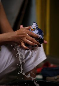 Close-up of woman hand holding water