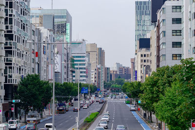 City street and buildings against sky