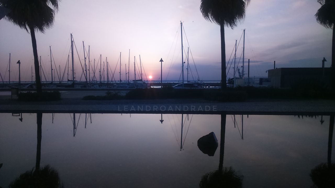 SCENIC VIEW OF LAKE AT SUNSET