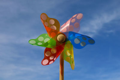 Close-up of toys against blue sky