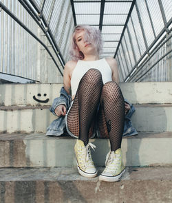 Young woman sitting outdoors