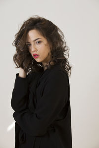 Portrait of a beautiful young woman over white background