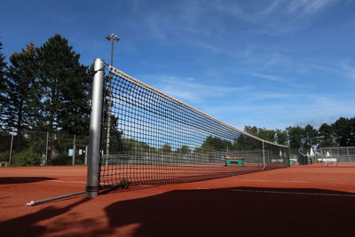 Scenic view of tennis court against sky