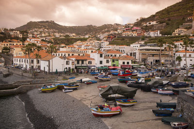 View of townscape by mountain against sky