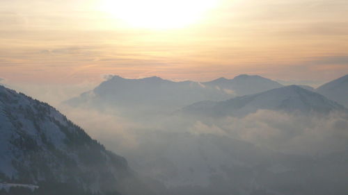 Scenic view of mountains against sky during sunset