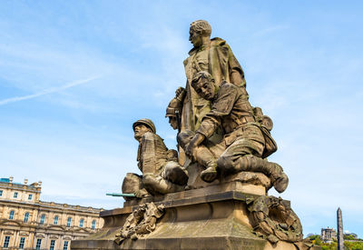 Low angle view of statue of liberty against sky