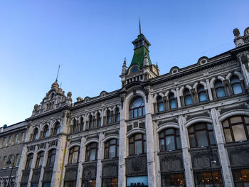 Low angle view of building against blue sky