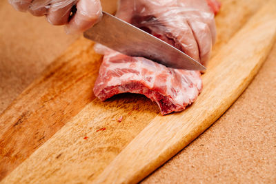 Close-up of person preparing food on cutting board