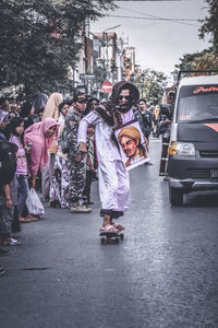 People standing on street in city