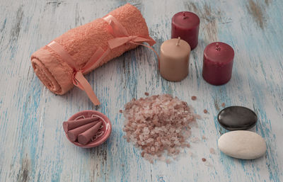 High angle view of spa treatment items on wooden table