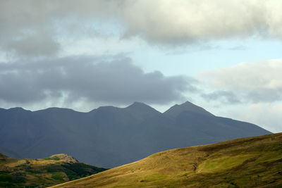 Golden mountains at hillside on cloudy weather