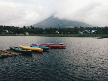 Boat in lake against sky