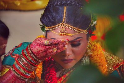 Bride performing rituals during wedding ceremony