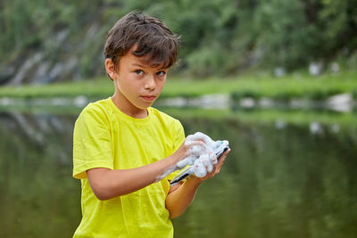 Boy holding lake