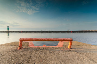 Pier over sea against sky