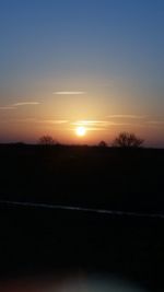 Scenic view of silhouette landscape against sky during sunset