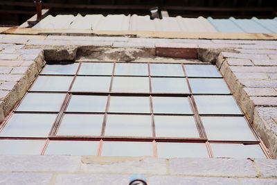 Low angle view of building seen through window