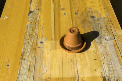 High angle view of earthenware on old wooden table