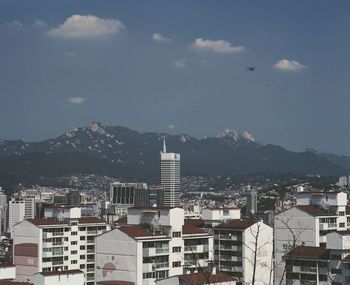 High angle view of buildings against sky