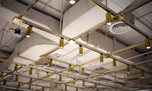 Low angle view of illuminated ceiling in building