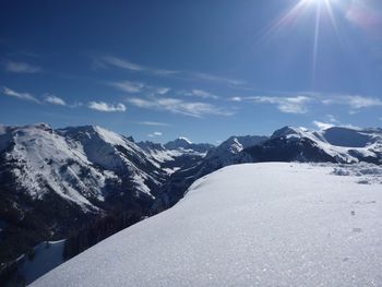 Scenic view of snow mountains against sky