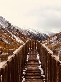 Wooden observation point against mountain and sky