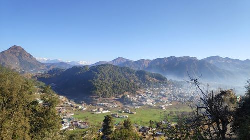 Scenic view of mountains against clear blue sky