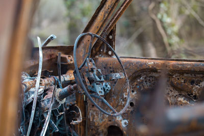 Close-up of rusty abandoned car