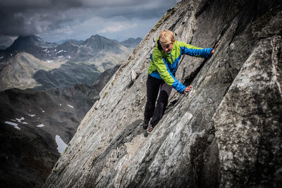 Full length of person on rock against mountains